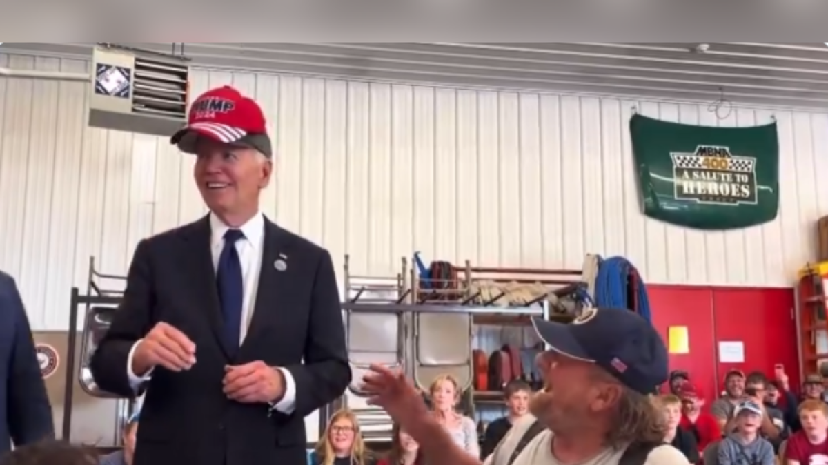 Biden wearing a MAGA hat