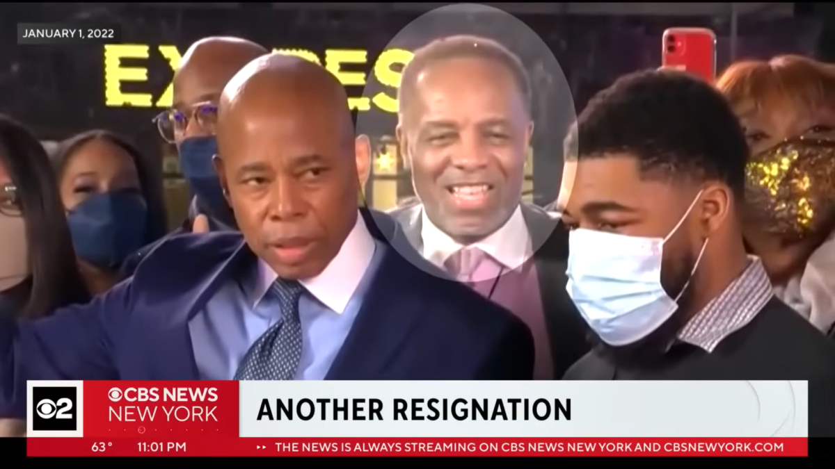 Tim Pearson, behind Eric Adams, at a New York City rally.