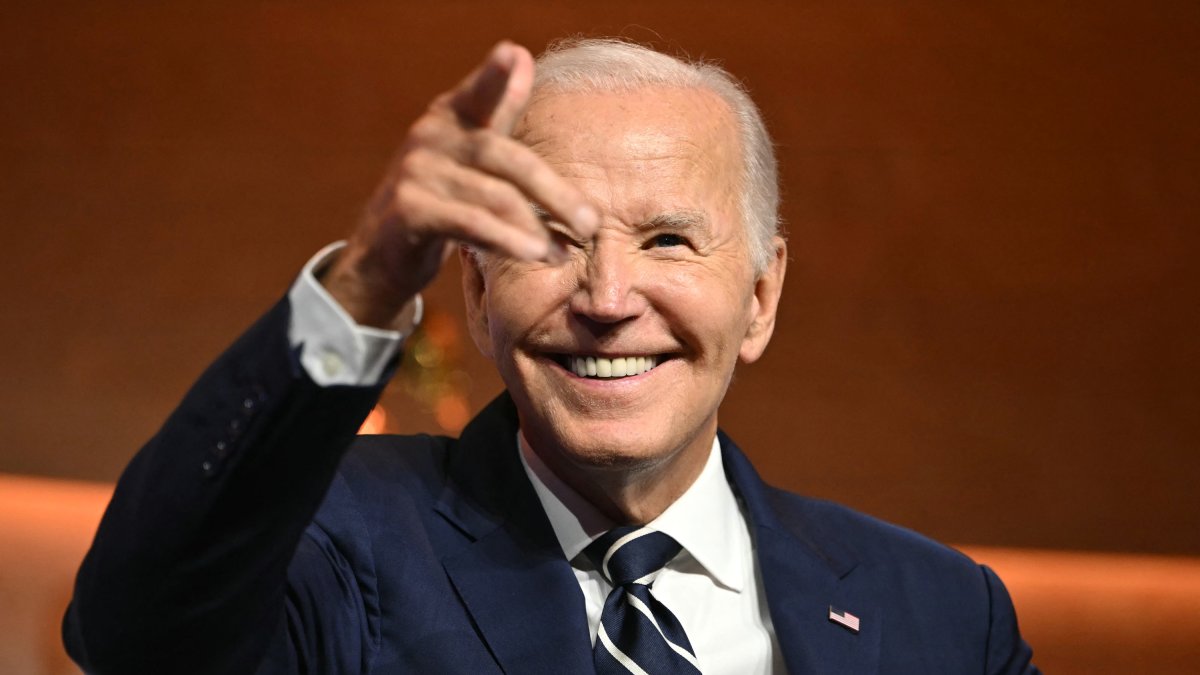 Biden smiles during an event