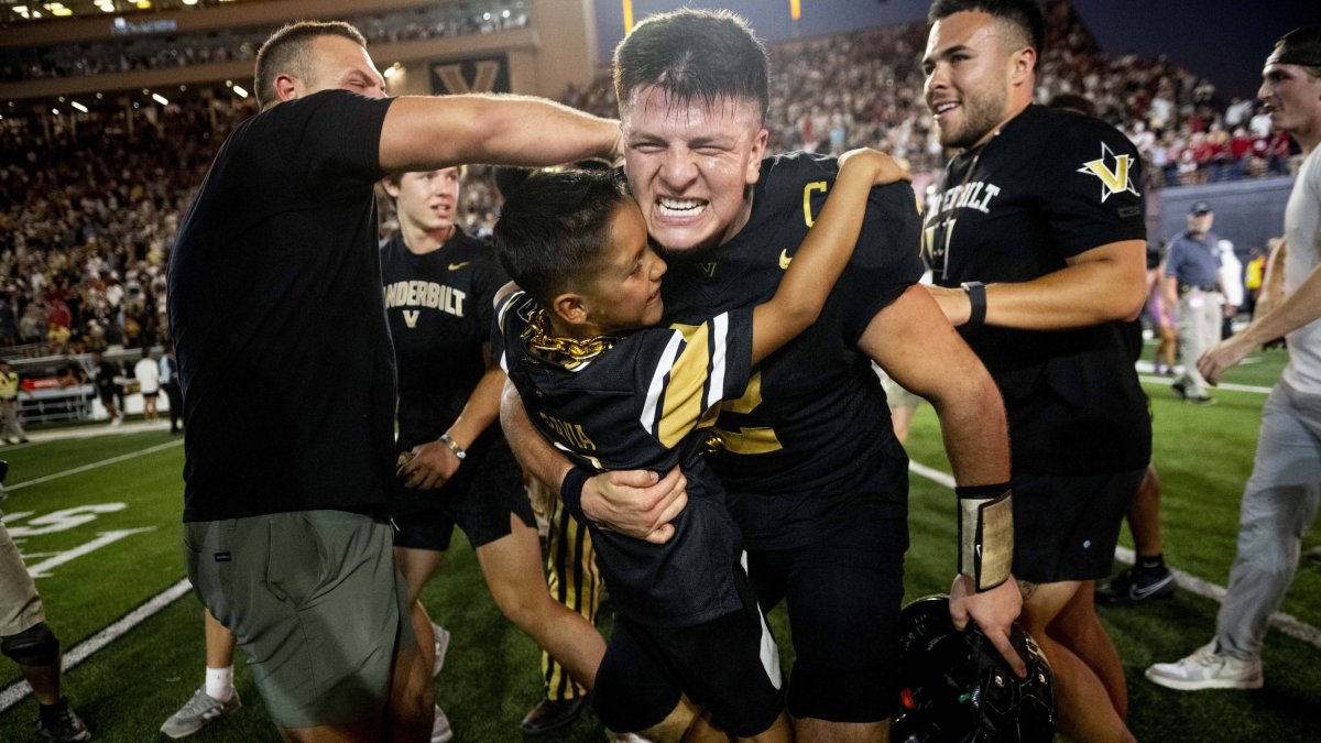 Diego Pavia celebrates with fans after the historic win over Alabama.