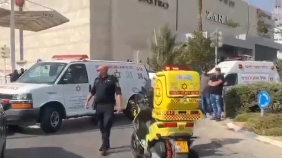 Screenshot with rescuers and police at the bombing site