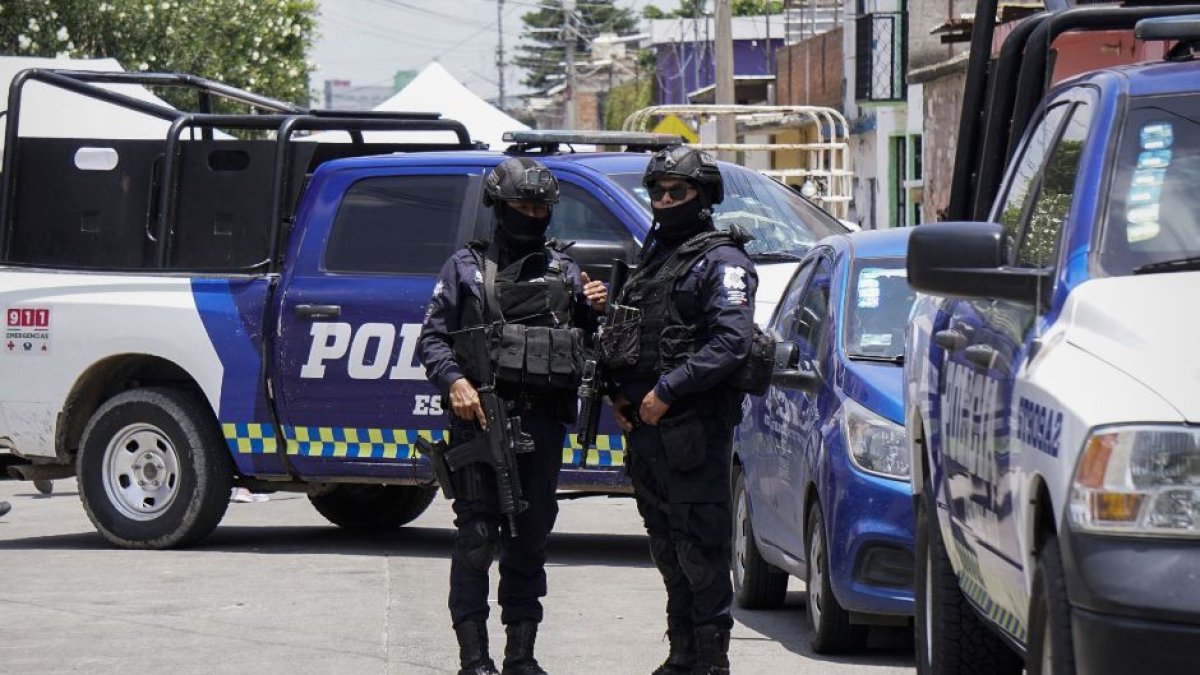 Policemen stand guard after a violent event in Mexico in a file image.