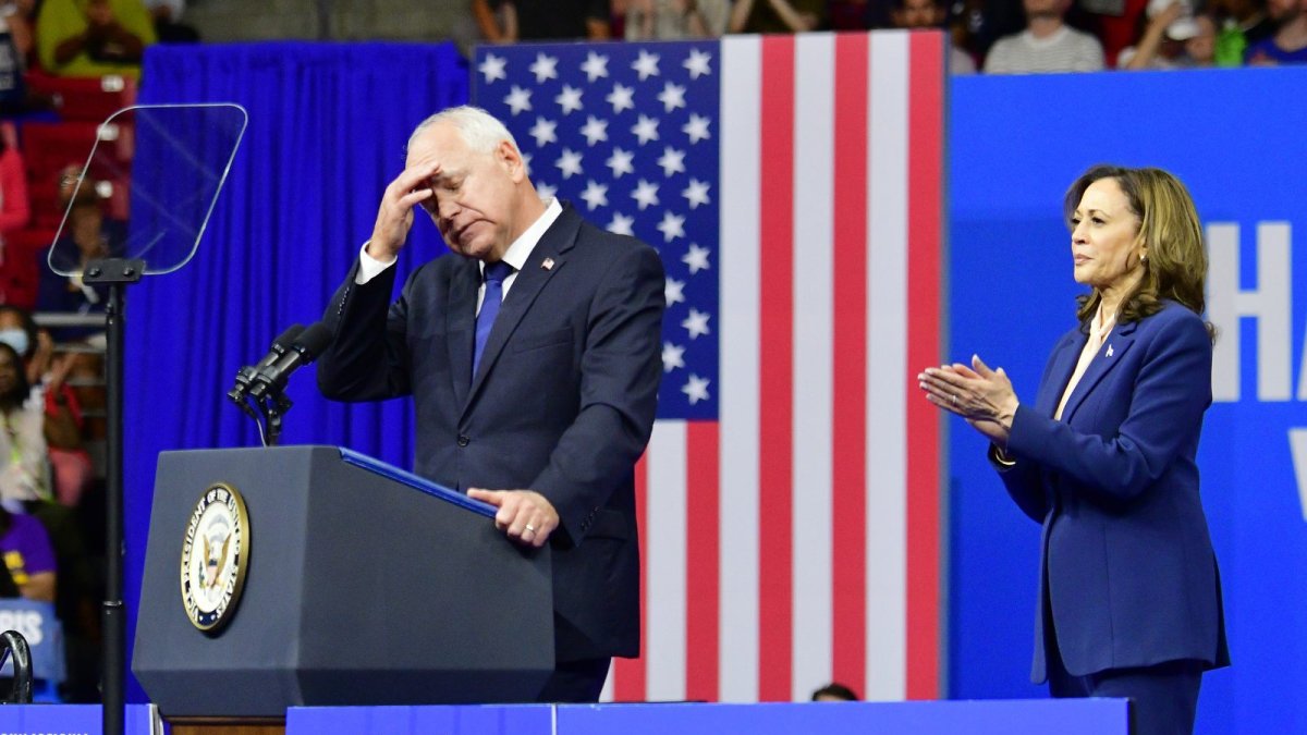 A crestfallen Tim Walz takes the floor before Kamala Harris at a campaign rally.