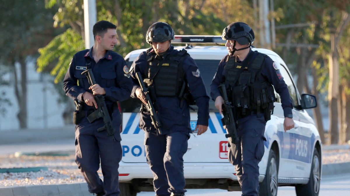 Turkish police at the scene of the crime, near TUSAS headquarters.