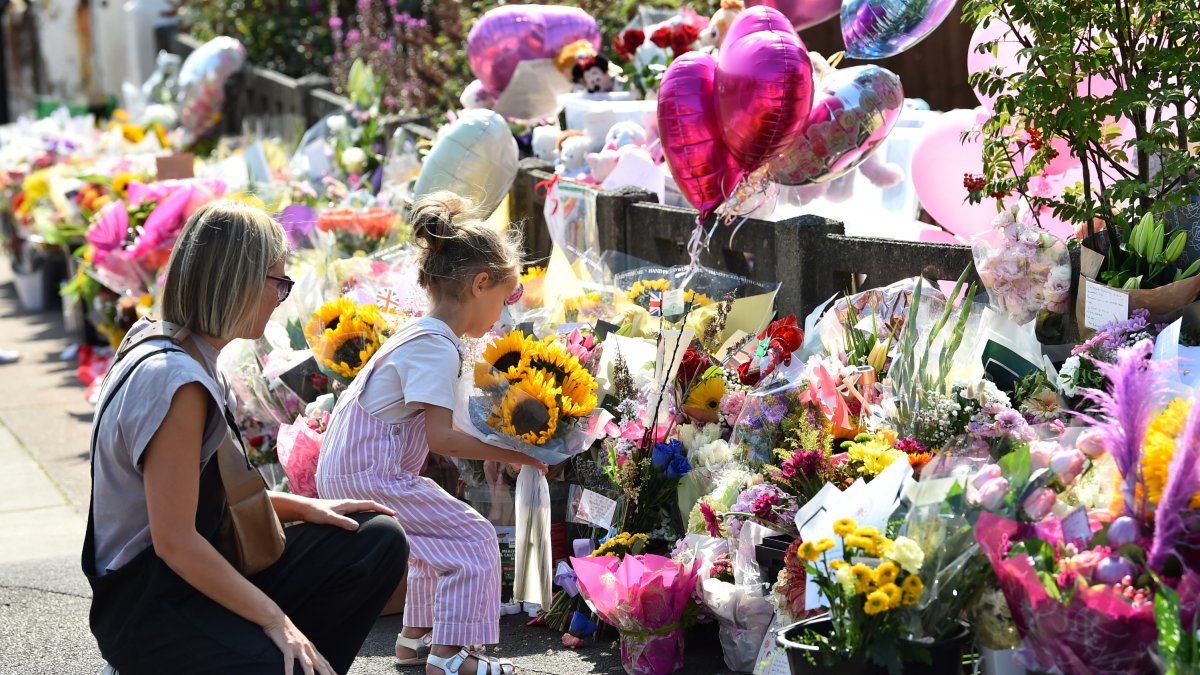 Flowers and balloons in tribute to three girls killed in Southport attack.