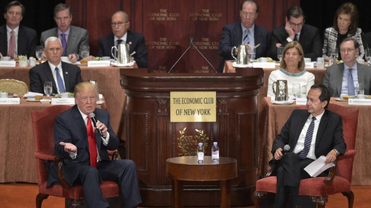 Donald Trump speaking during a talk with financier John Paulson.