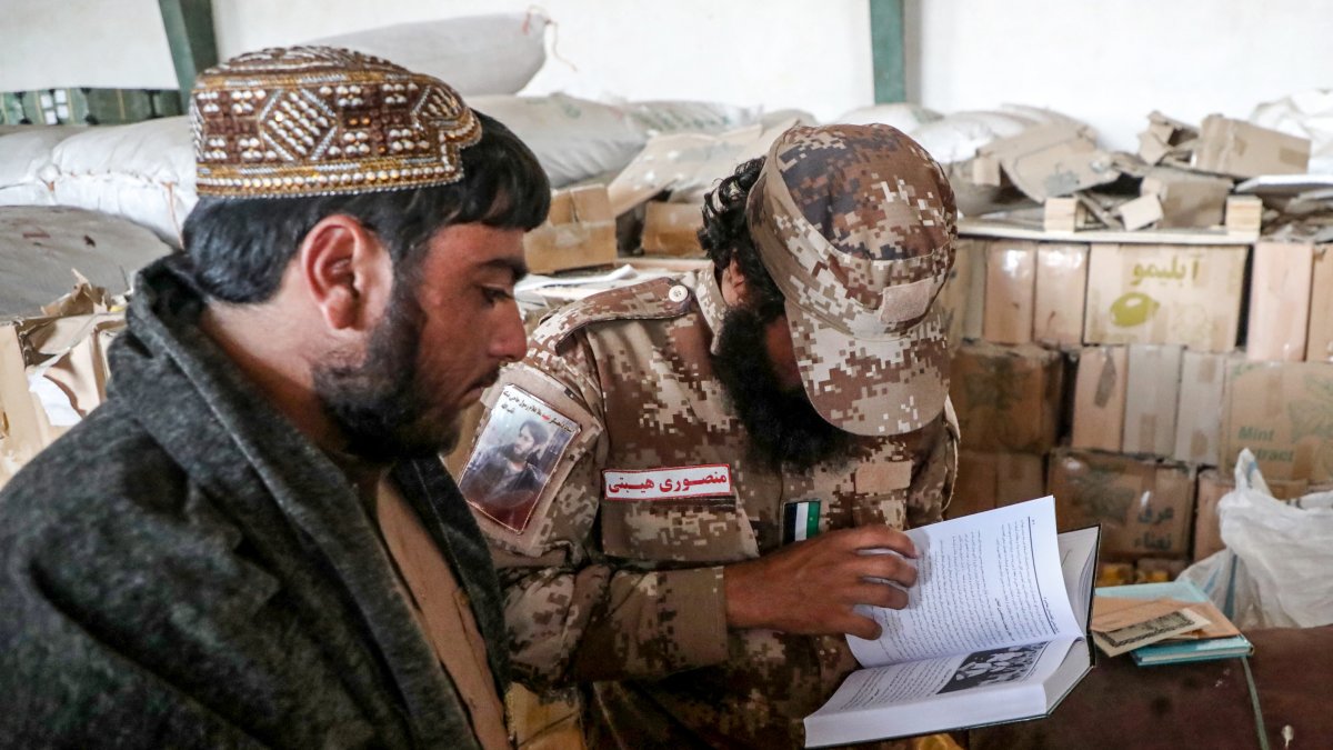 Taliban officials evaluate imported books in Herat, Afghanistan.