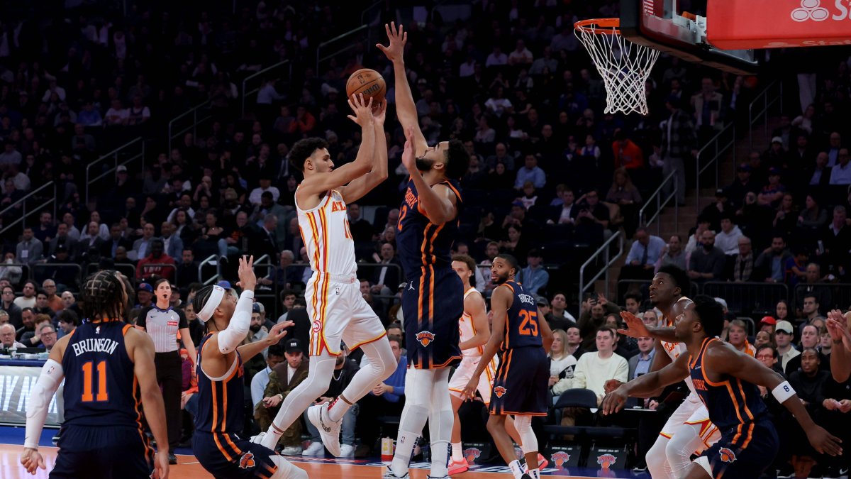 Zaccharie Risacher drives to the basket against Karl-Anthony Towns.