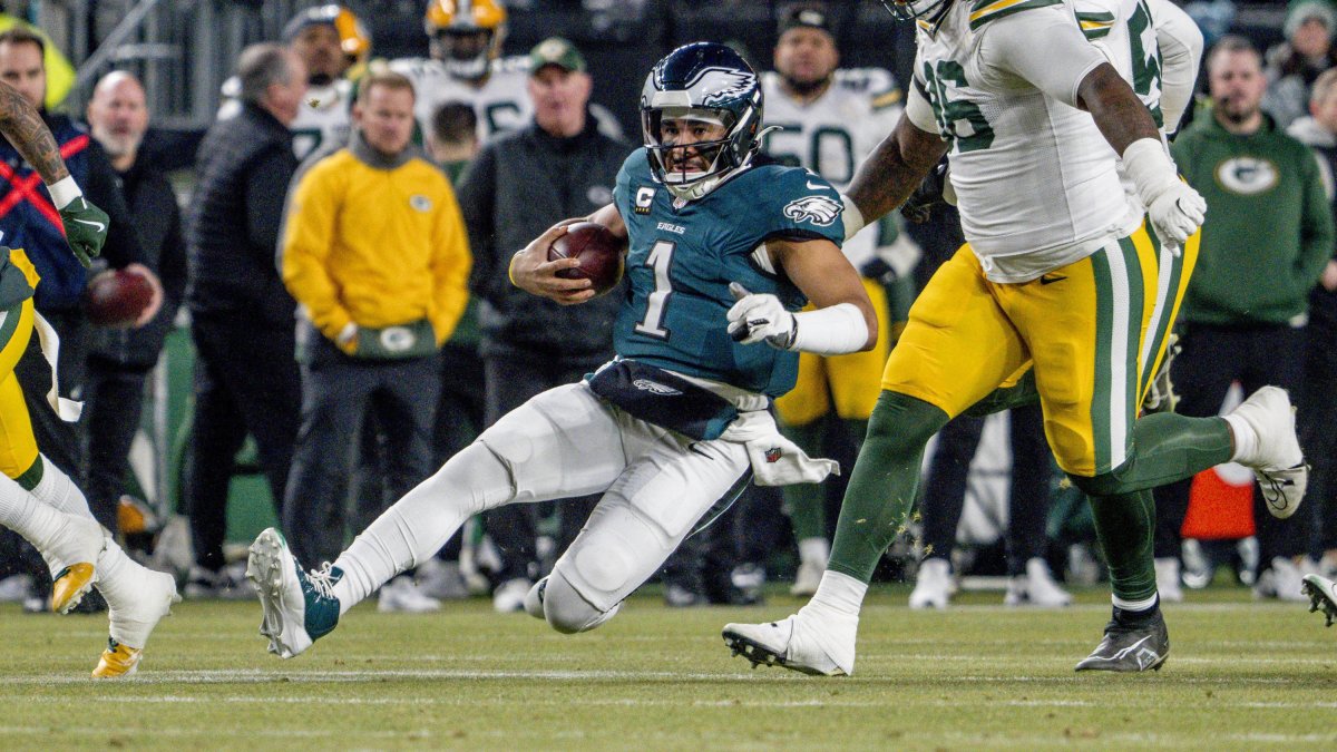 Philadelphia Eagles quarterback Jalen Hurts slides after a run.
