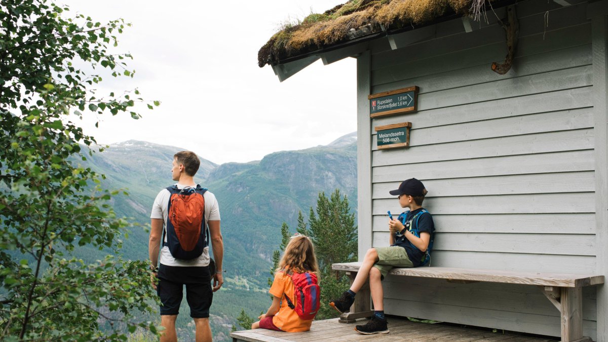 A family out for a walk on a mountain
