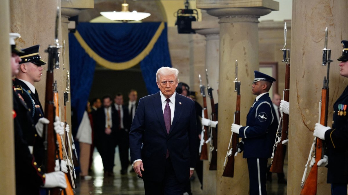Donald Trump walks through a National Guard hall of honor