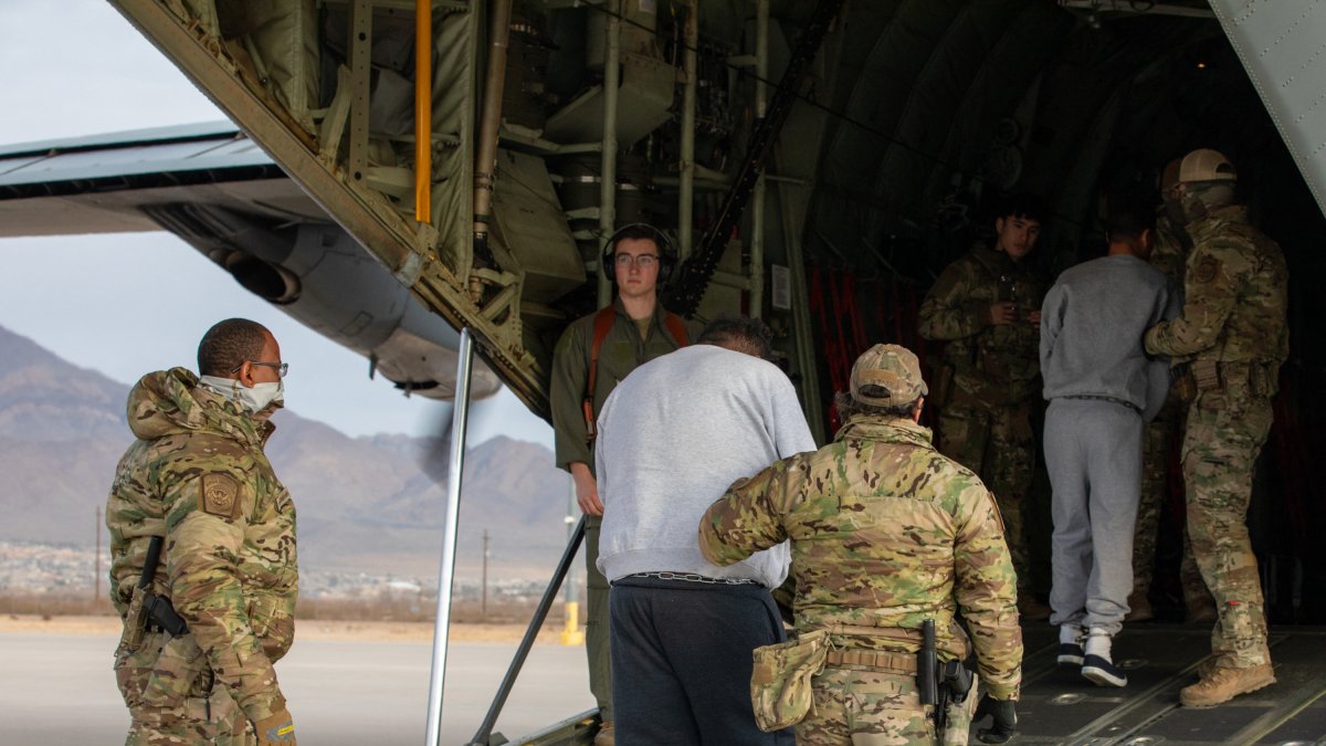 Deported illegal immigrants and criminals, boarding a plane. File image