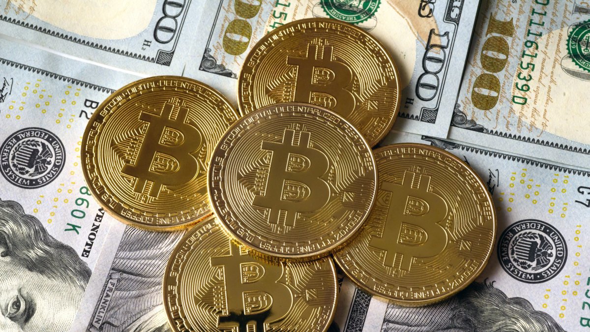 Image of bitcoins on banknotes.