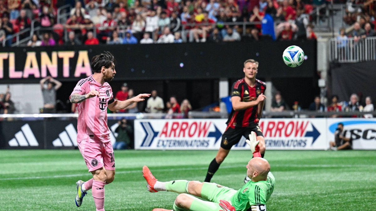 Messi lifts the ball over Guzan for what would be Inter's first goal.