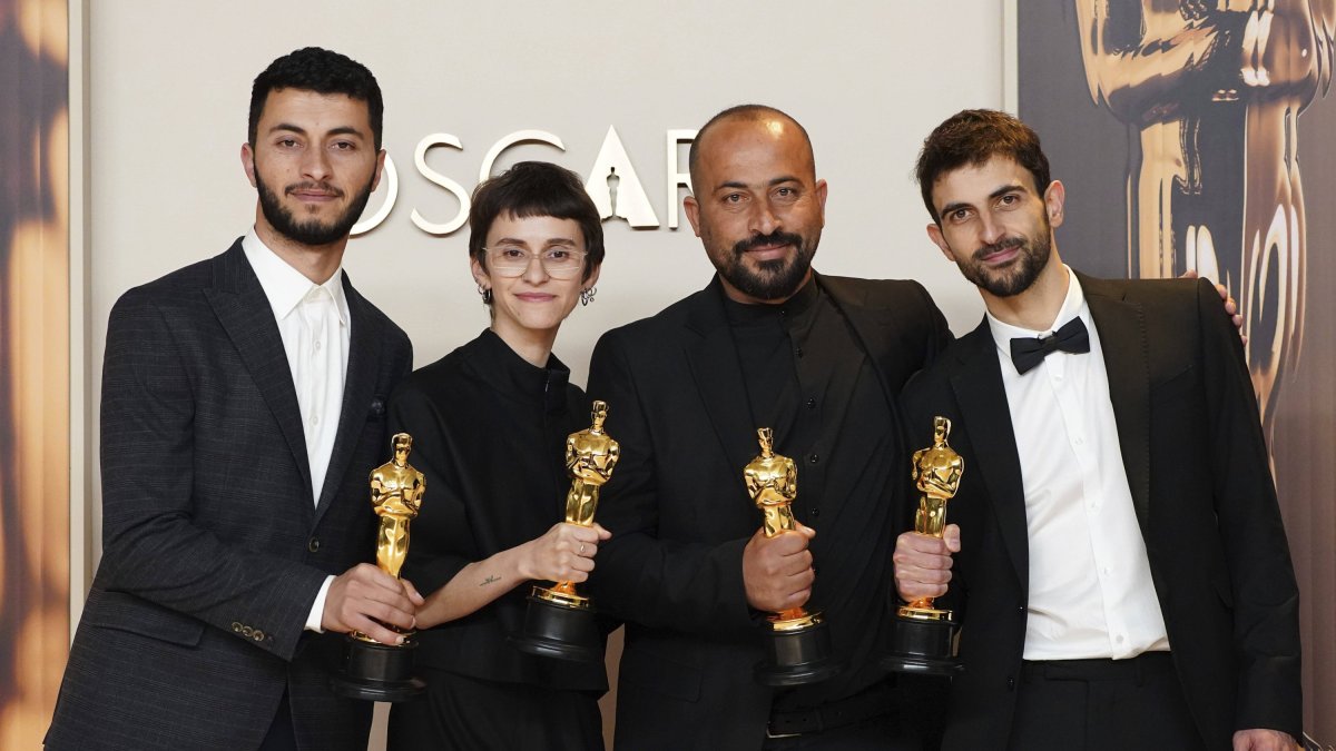 Hamdan Ballal (second from the right) after receiving the Oscar