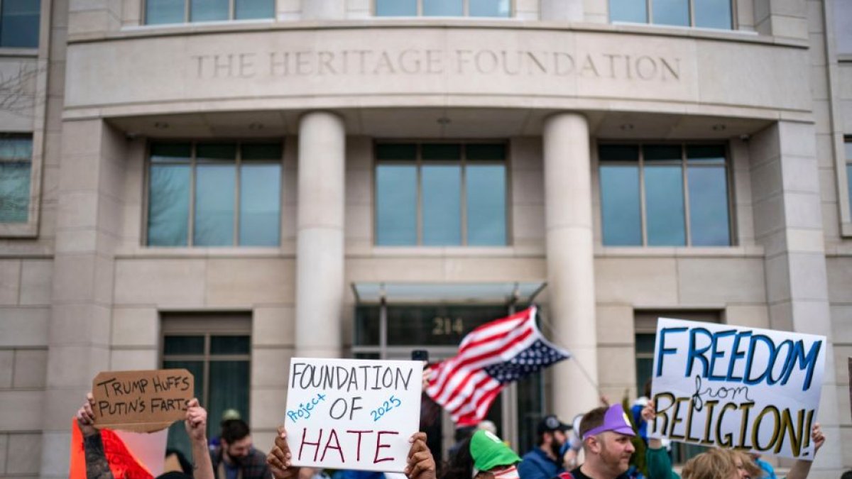 People protesting Project 2025 in front of the Heritage Foundation in Washington, D.C.