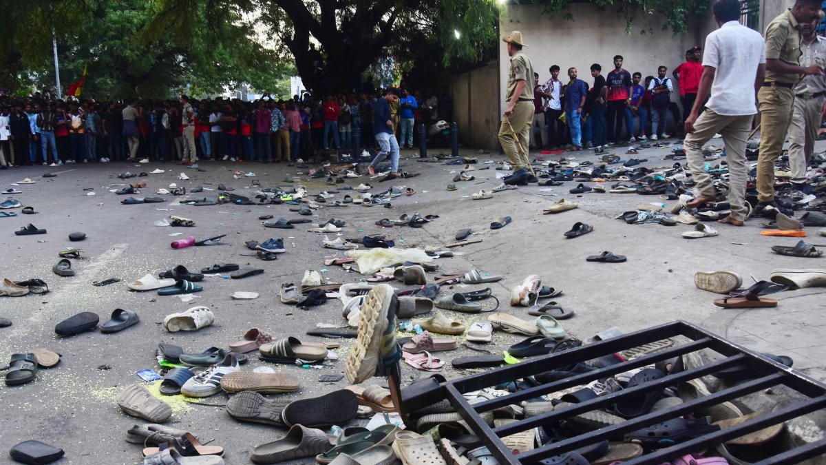 Footwear abandoned on street after stampede in Bangolore.