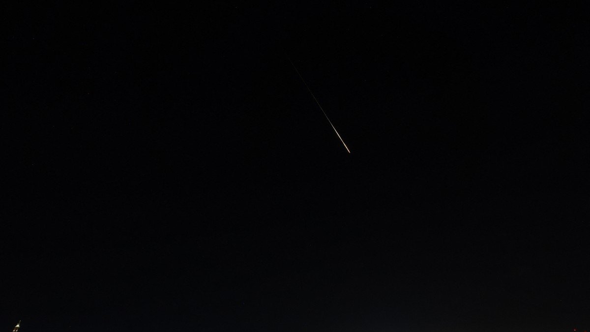 This picture shows a rocket trail from Israel's Iron Dome missile-defence system batteries fired to intercept rockets fired from Iran.