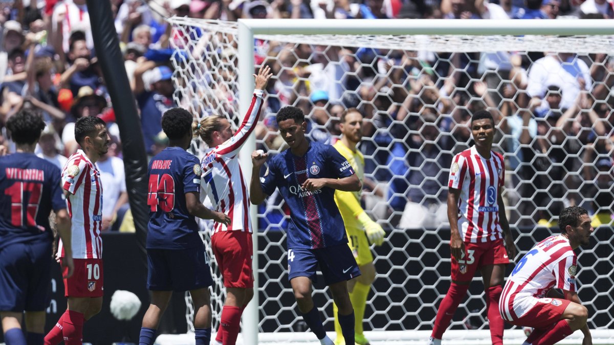 PSG players celebrate a goal against Atlético.