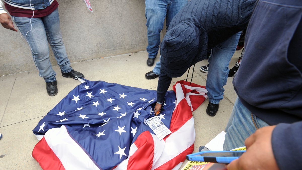 Protester tries to burn national flag in Baltimore