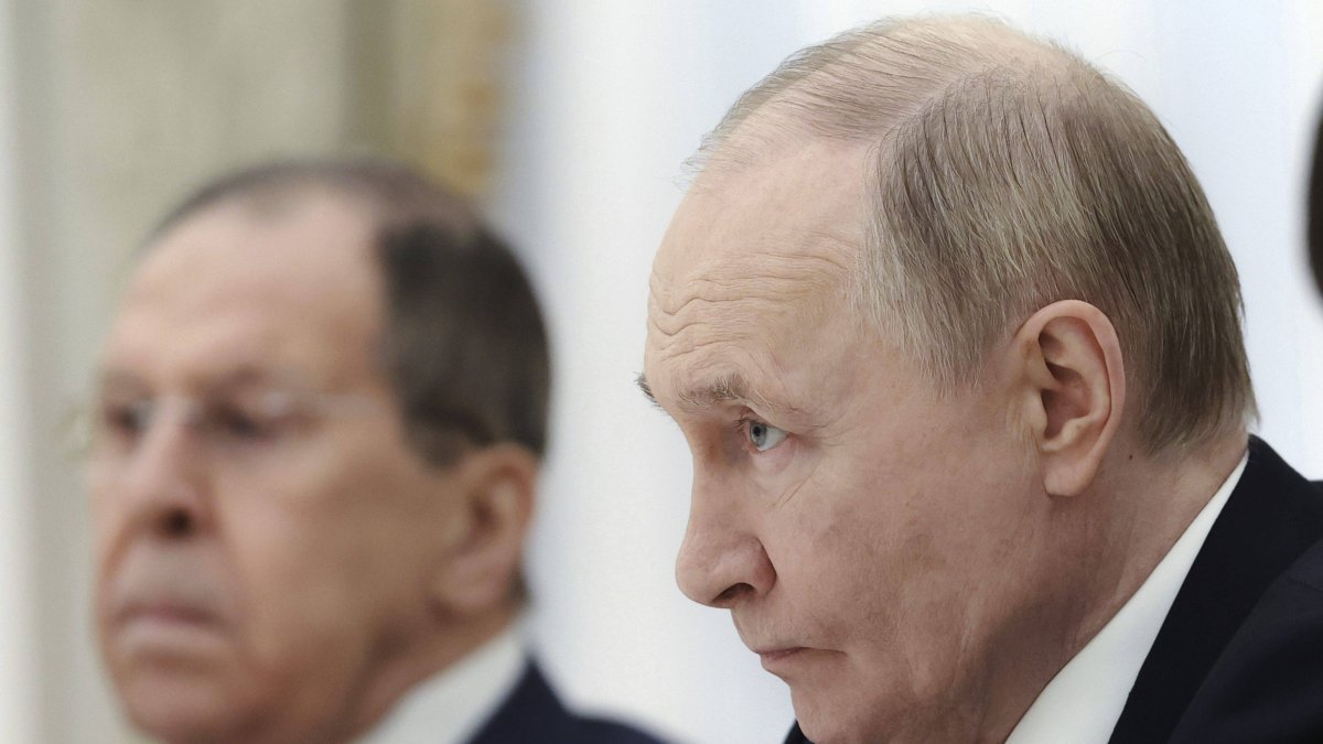 Vladimir Putin and Sergey Lavrov