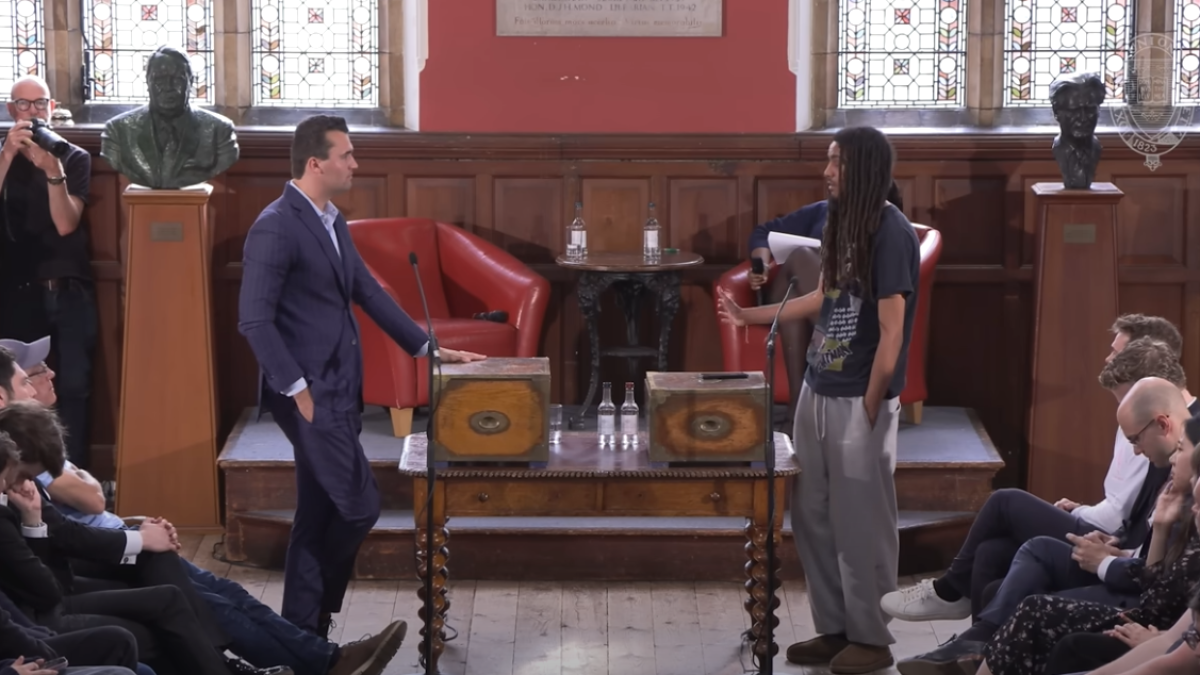 Charlie Kirk debates with George Abaraonye .