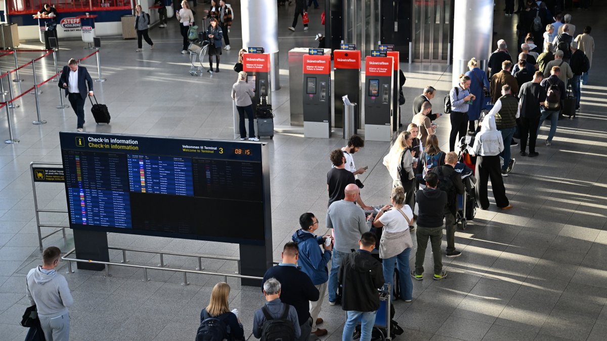 Passengers with their delayed flights at an airport in Denmark.