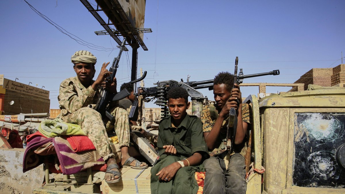 Soldiers in Allafah market, an area recaptured by the Sudanese Army.