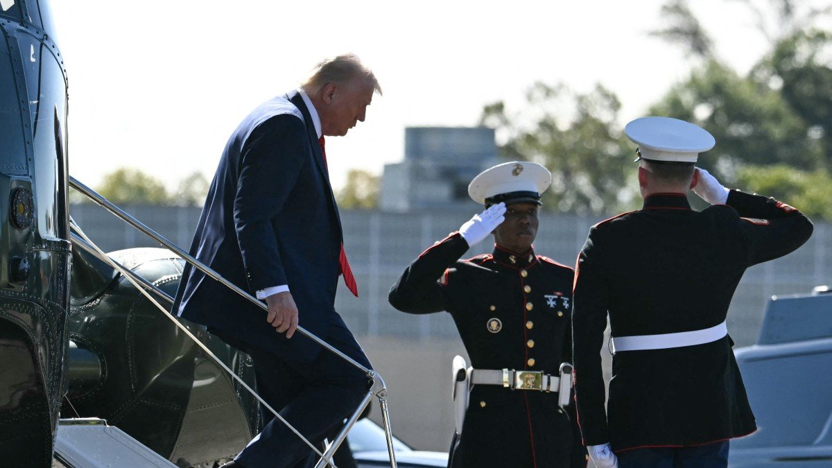 Donald Trump descends from Marine One upon arrival at Walter Reed National Military Medical Center.