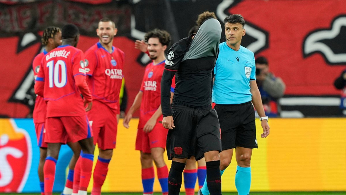 PSG players celebrate one of the goals in their victory over Leverkusen.