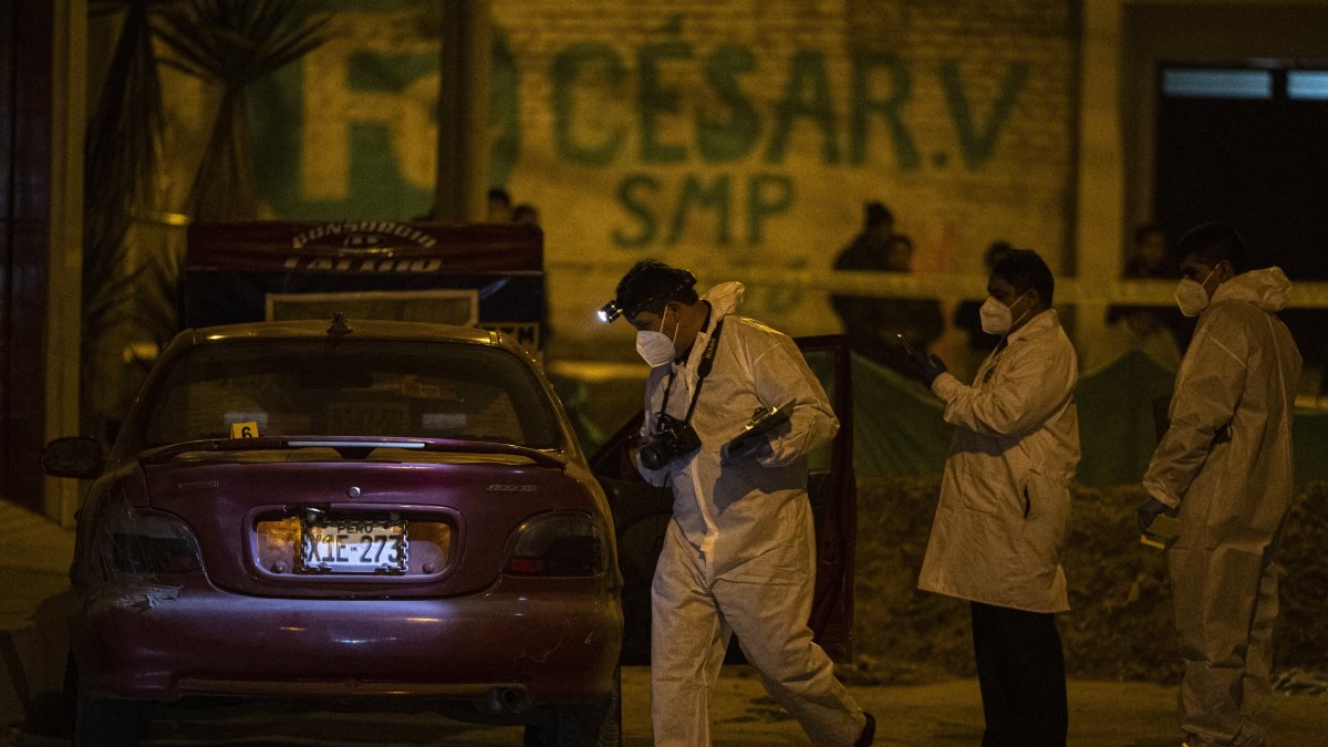 Peruvian police investigating a crime scene