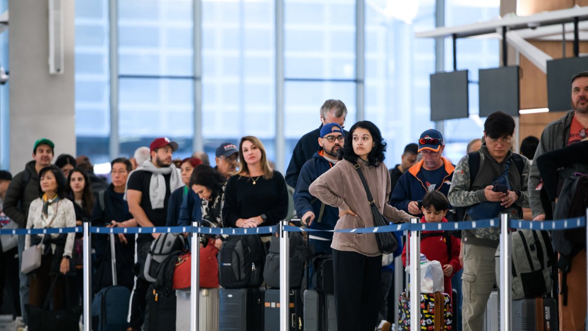 (File) Hundreds of people wait at George Bush Airport in Houston.