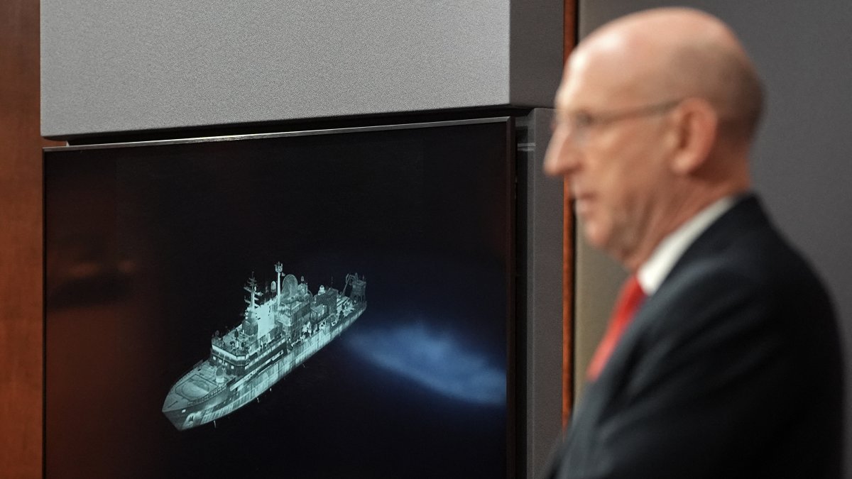 The UK defense minister shows an image of the Russian ship Yantar sailing in British waters.