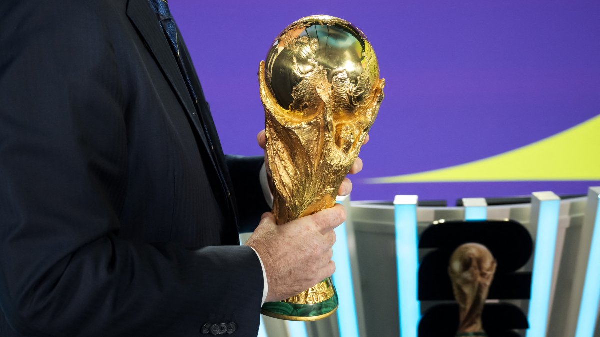 The FIFA World Cup trophy in the hands of FIFA president Gianni Infantino