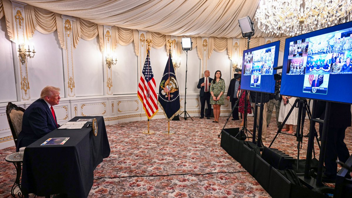 President Donald Trump meets in conference with soldiers serving in the Caribbean.