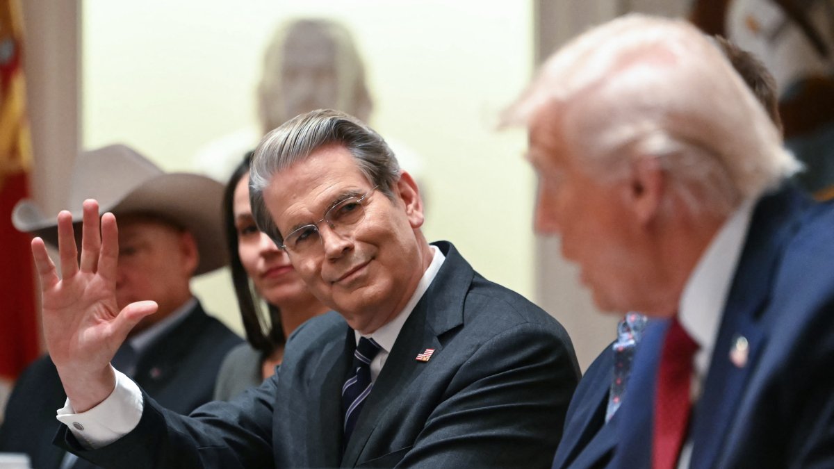 Scott Bessent with Trump at the White House/ Andrew Caballero- Reynolds.