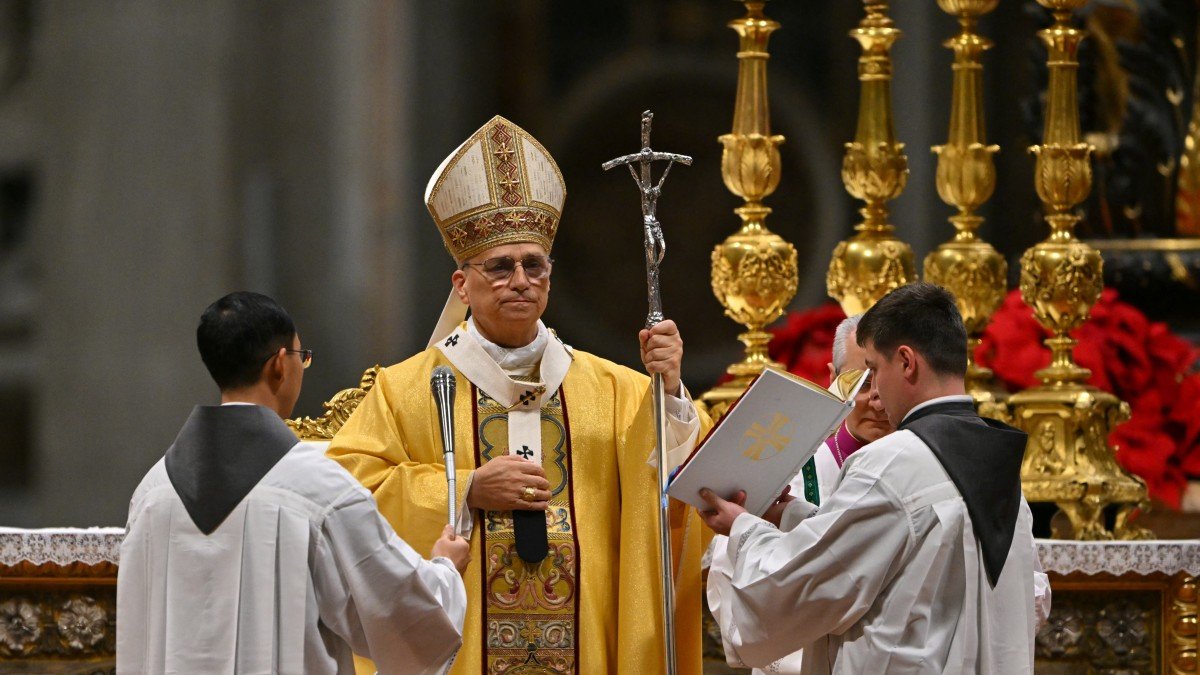 Pope Leo XIV (C) officiates at Christmas Eve Mass in St. Peter's Basilica at the Vatican