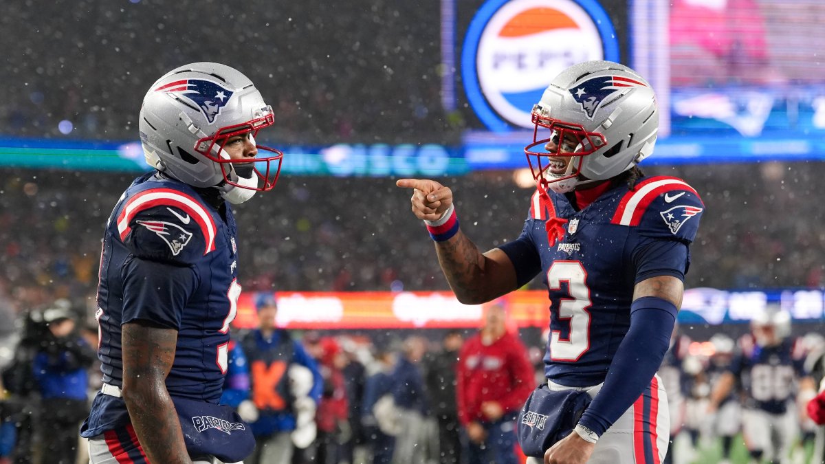 Kayshon Boutte (9) and Demario Douglas (3) celebrate a touchdown.