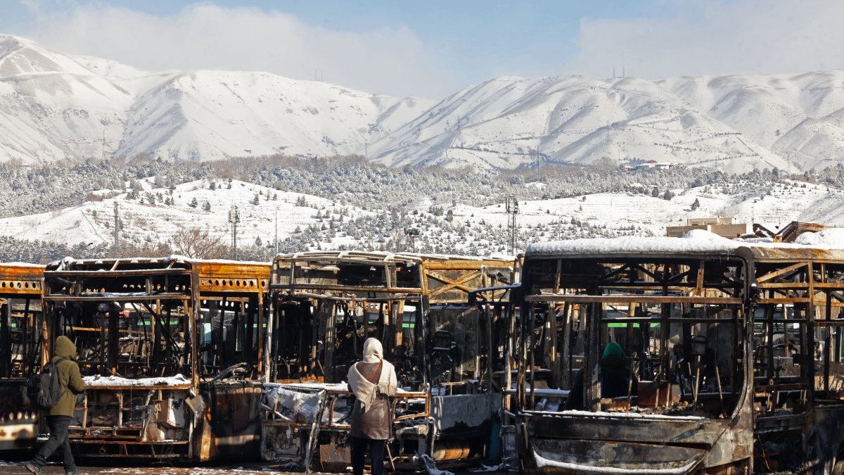 Buses that were burnt at a depot during recent public protests, in Tehran on January 21, 2026