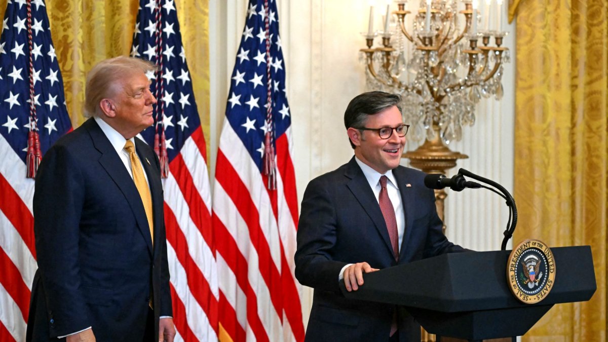 Donald Trump with Mike Johnson in a file image