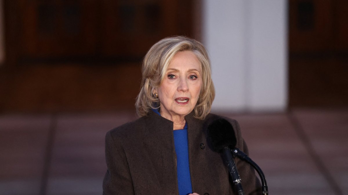 Hillary Clinton appears before reporters after her congressional testimony