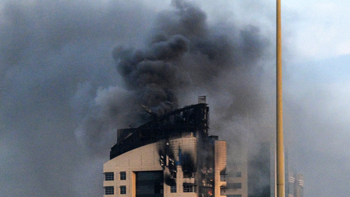 Smoke rises from a high-rise building following a drone attack in Kuwait City