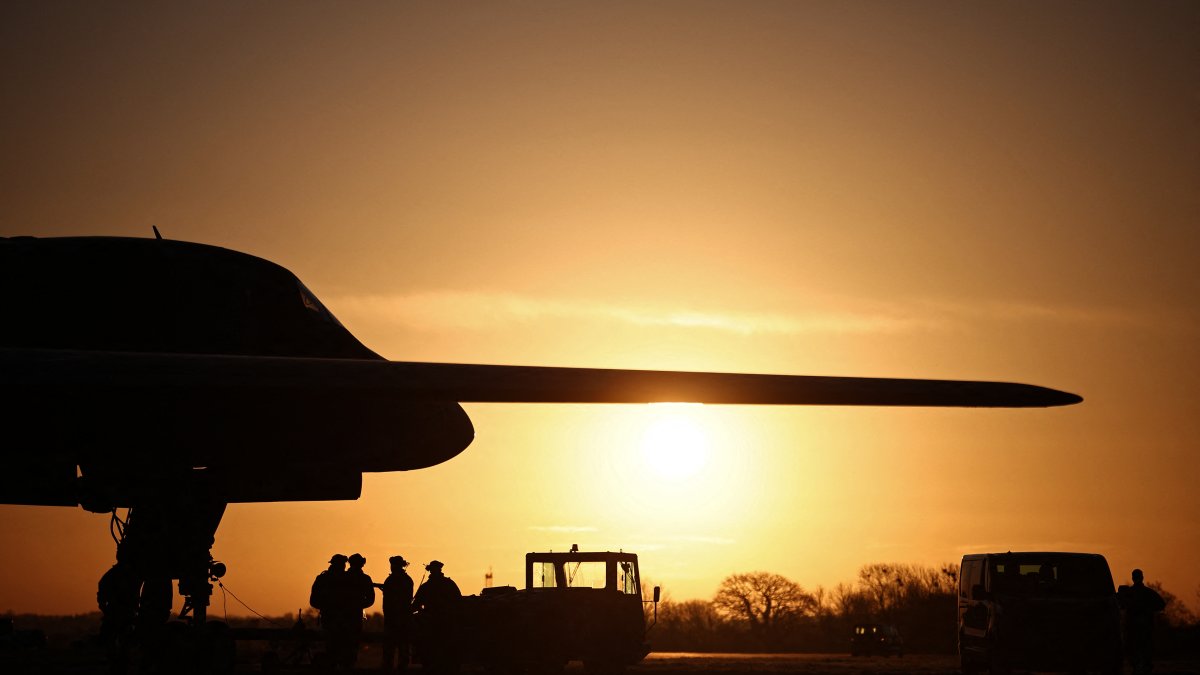 The USAF works under a B-1 bomber.
