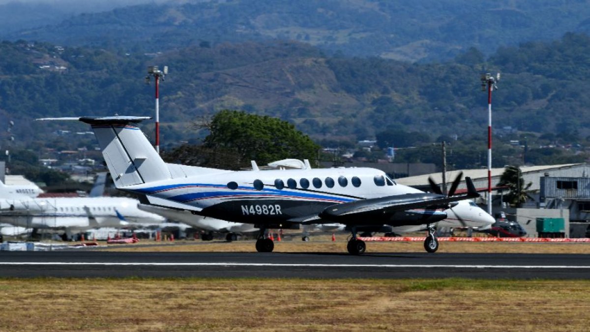 A DEA plane takes off during the extradition operation.