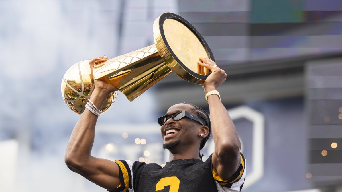 Shai Gilgeous-Alexander with the Larry O'Brien Trophy after winning the 2025 NBA Finals with the Thunder. File image