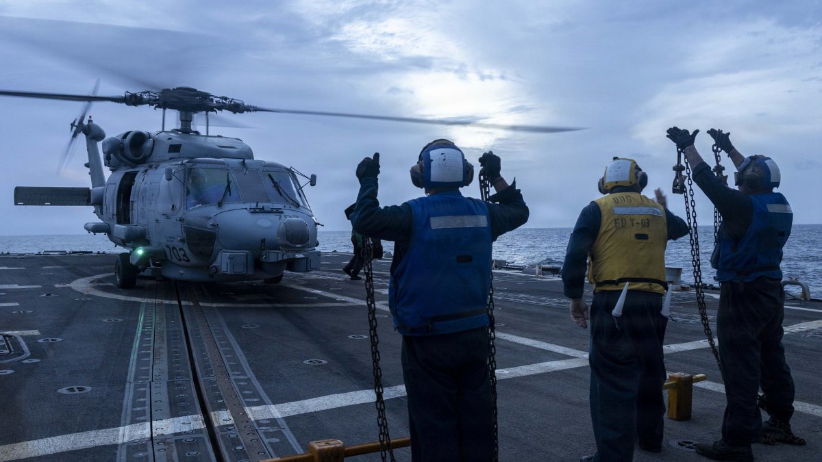 A helicopter on the deck of the USS Delbert D. Black.