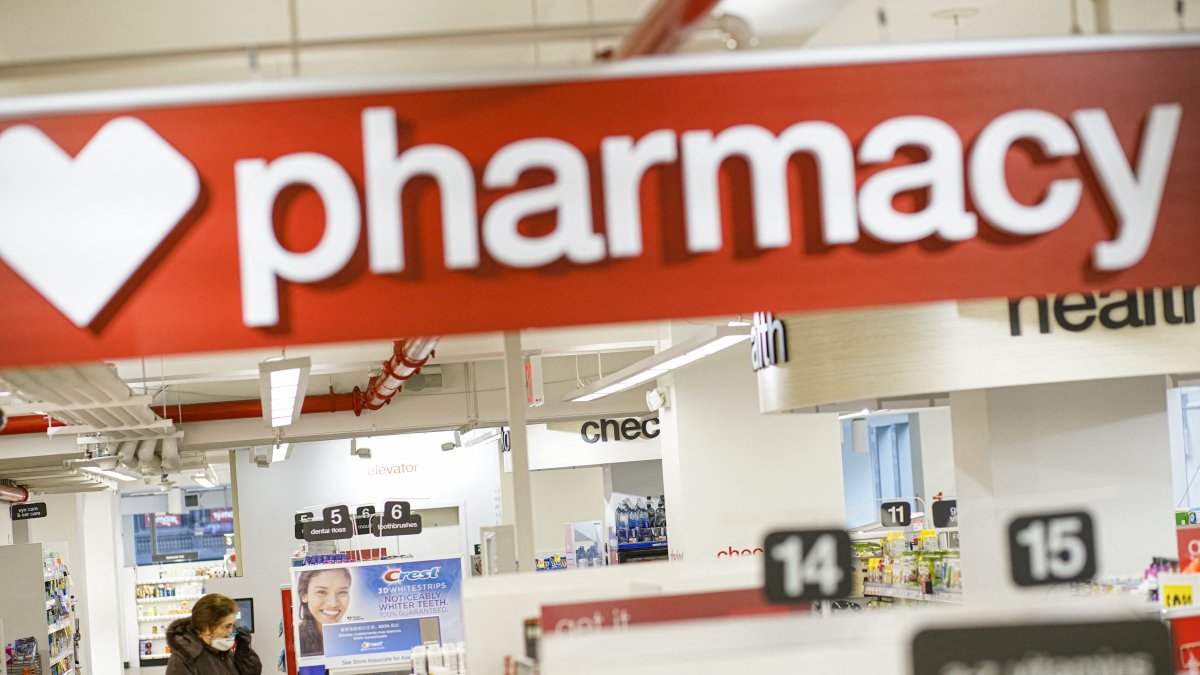 A woman searches for a drug at a pharmacy (File).