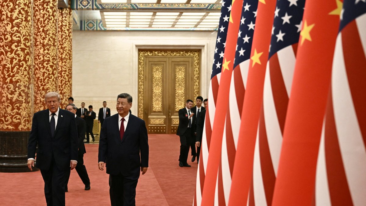 Chinese President Xi Jinping and U.S. President Donald Trump arrive for a state banquet at the Great Hall of the People in Beijing on May 14, 2026.