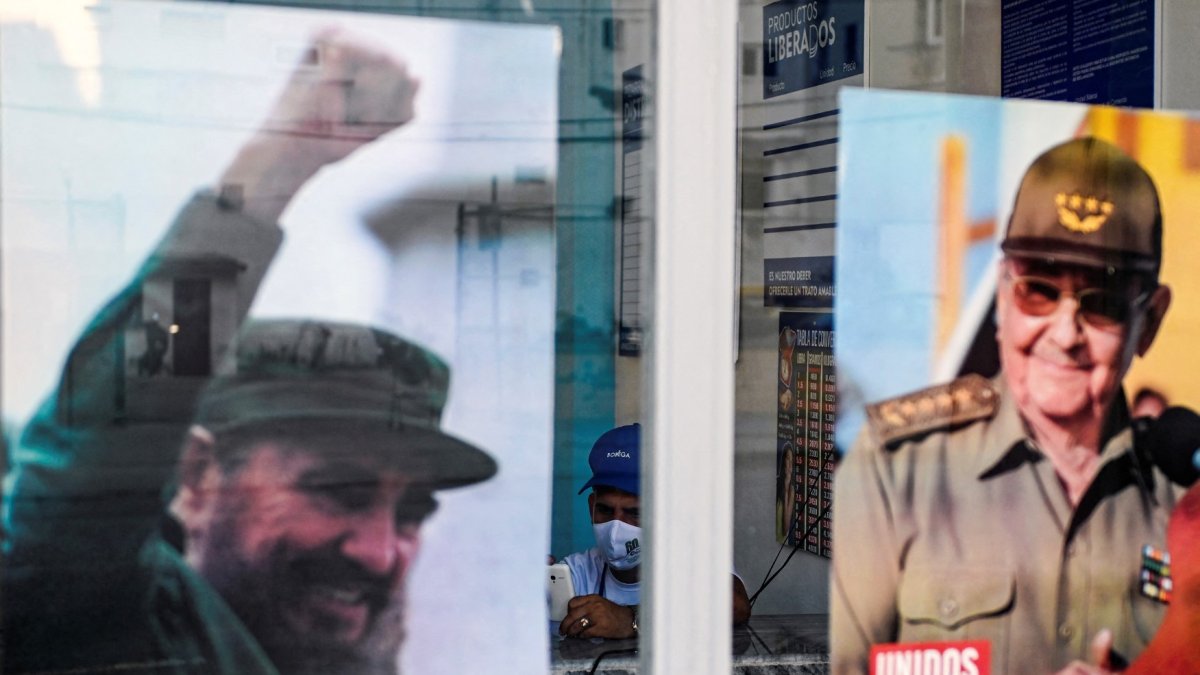 In Cuba, posters of the late Fidel Castro and his brother, Raul Castro.