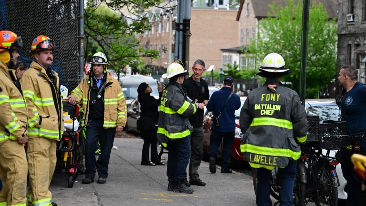 FDNY officials work at the scene of a fire / File